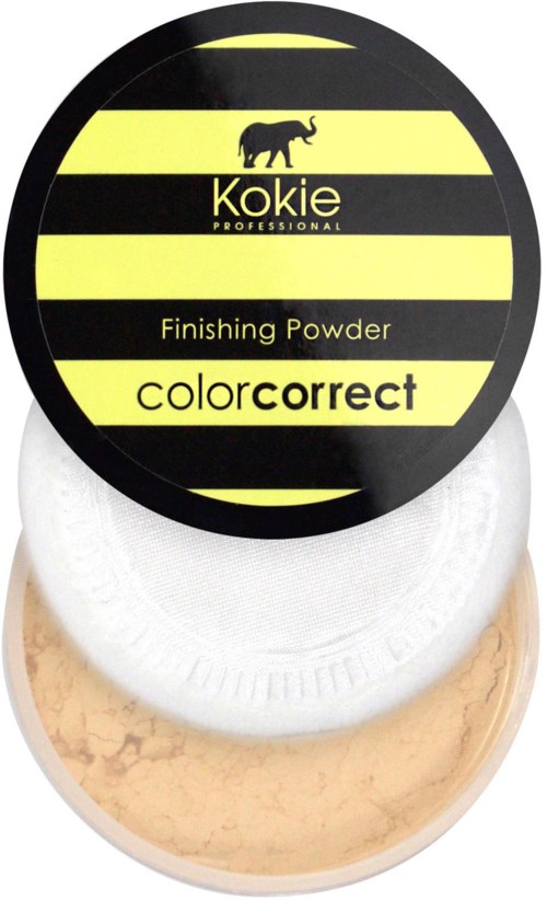 Een ronde container met een geel en zwart gestreept label, met een neushoorn, gelabeld 'Kokie Finishing Powder'.