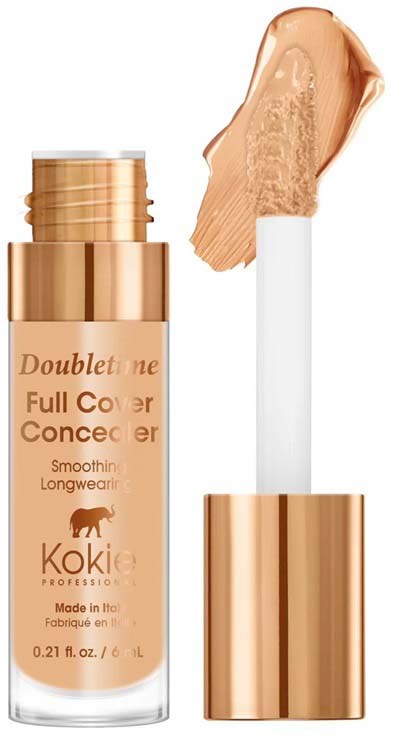 En beige foundationflaska med en vit applikator och ett sminkprov på den.