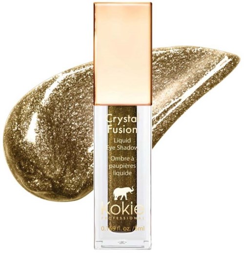 En klar flytande ögonskugga från KOKIE med guldglitter, i en rektangulär flaska med beige lock.
