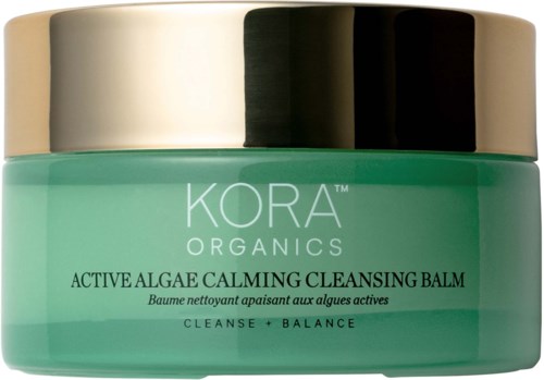 Ein grüner Behälter mit silbernem Deckel enthält KORA Organics Active Algae Calming Cleansing Balm.