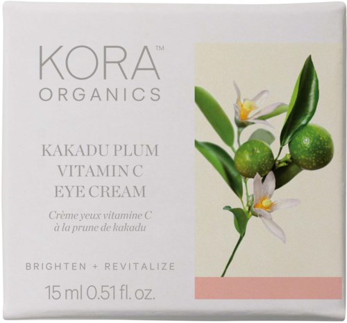 Eine Schachtel KORA Organics Kakadu Plum Vitamin C Eye Cream mit grüner Frucht und weißen Blumen auf der Verpackung.