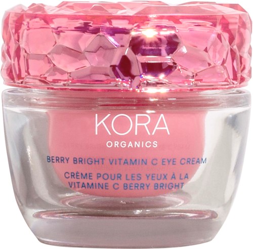 En burk med Kora Organics Berry Bright Vitamin C Eye Cream med ett rosa, ädelstensliknande lock och en klar glasbehållare.