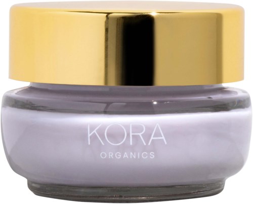 Ein kleiner Behälter mit goldener Kappe und weißem Körper, beschriftet mit 'KORA ORGANICS'.