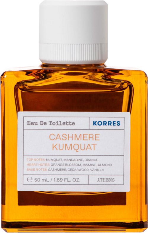 A small orange bottle with a white cap, labeled as Eau De Toilette with scent notes like orange and vanilla.