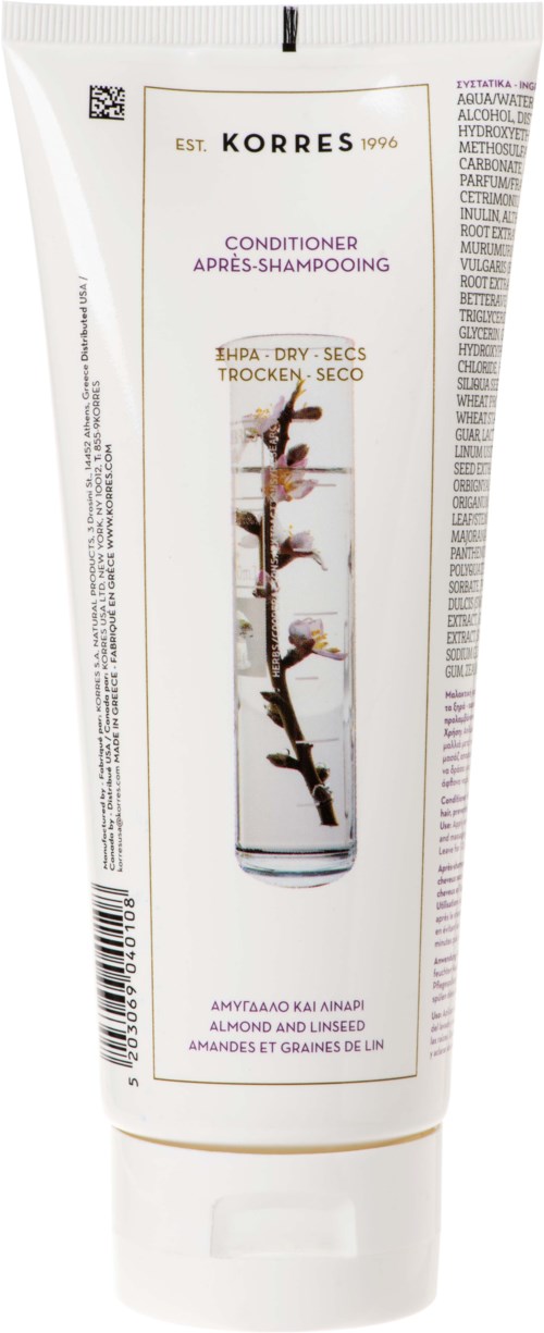A white tube of Korres conditioner with a plant and branch image, details of ingredients, and branding.