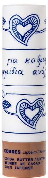 White lip balm with hand-drawn heart and leaf designs, and some handwritten text in blue, with a brown bottom label.