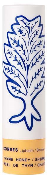 Lip balm with a blue leaf illustration and text about thyme honey flavor.
