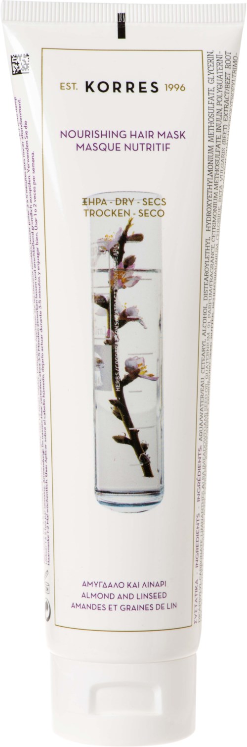 A white tube of Korres hair mask with a picture of a branch with flowers, and text describing its nourishing ingredients.