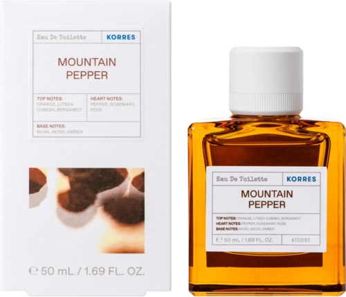 Mała butelka perfumu mountain pepper obok pudełka. Op pudełku jest tekst i rozmazane zdjęcie.