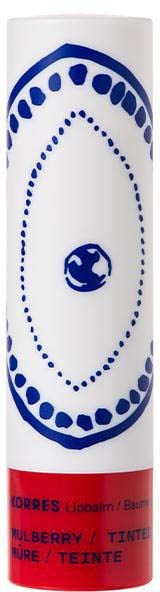 A white tube with blue designs and a red band at the bottom. It is labeled as lip balm or blush.