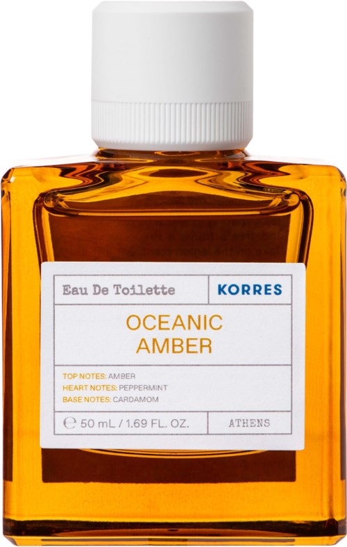 A small orange bottle of Korres Oceanic Amber perfume, with a white cap and a label showing fragrance details.