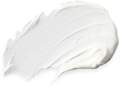 En vit kräm eller lotion som är utbredd med ett texturerat penseldrag. Den ser mjuk och slät ut.