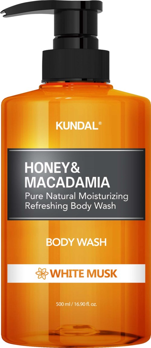Orange bottle with black pump, labeled 'Honey & Macadamia' and 'White Musk', for body wash. KUNDAL branding visible.