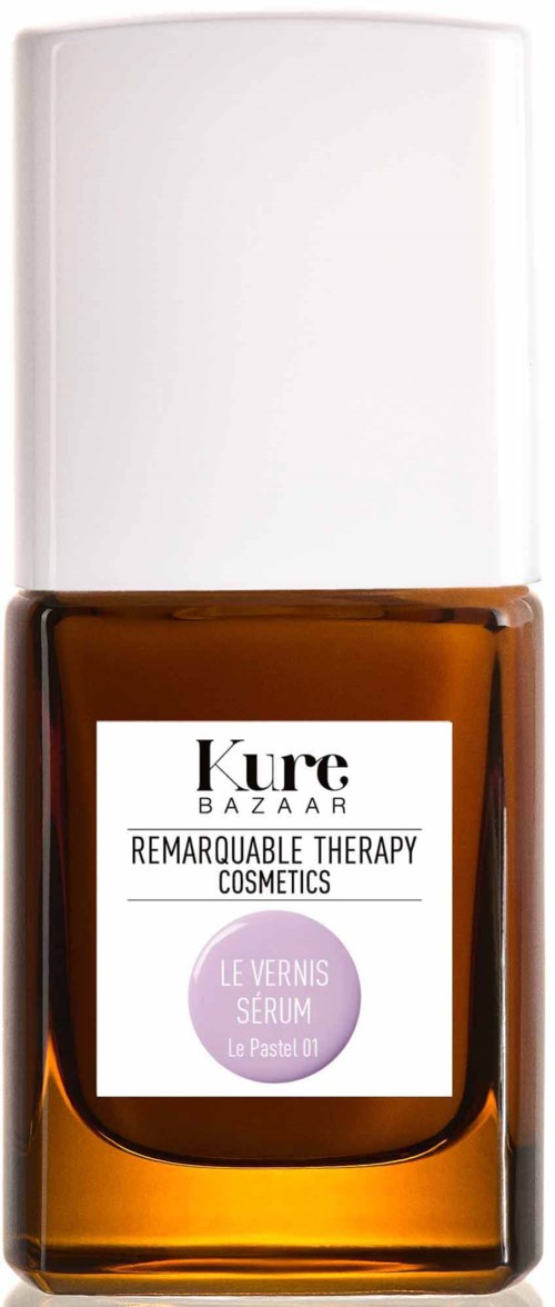 Eine braune Glasflasche mit weißem Deckel, etiketti mit 'Kure Bazaar' und 'Remarkable Therapy Cosmetics' in lila und schwarz.