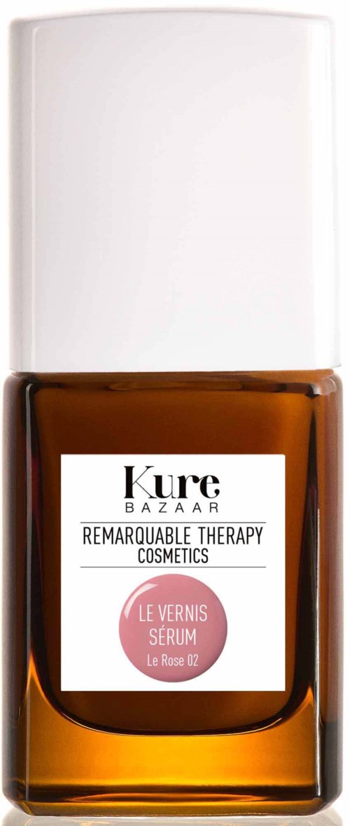 Eine braune Nagellackflasche mit weißem Deckel und Etikett, namens Kure Bazaar, Le Vernis Serum.