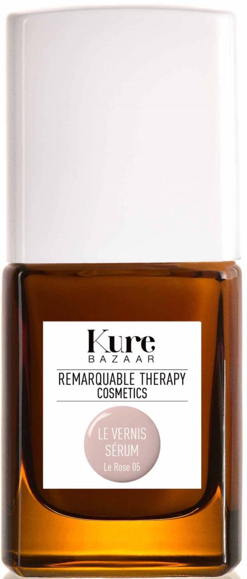 Eine braune Flasche mit weißem Deckel und einem Etikett, das "Kure Bazaar Remarquable Therapy Cosmetics" sagt.