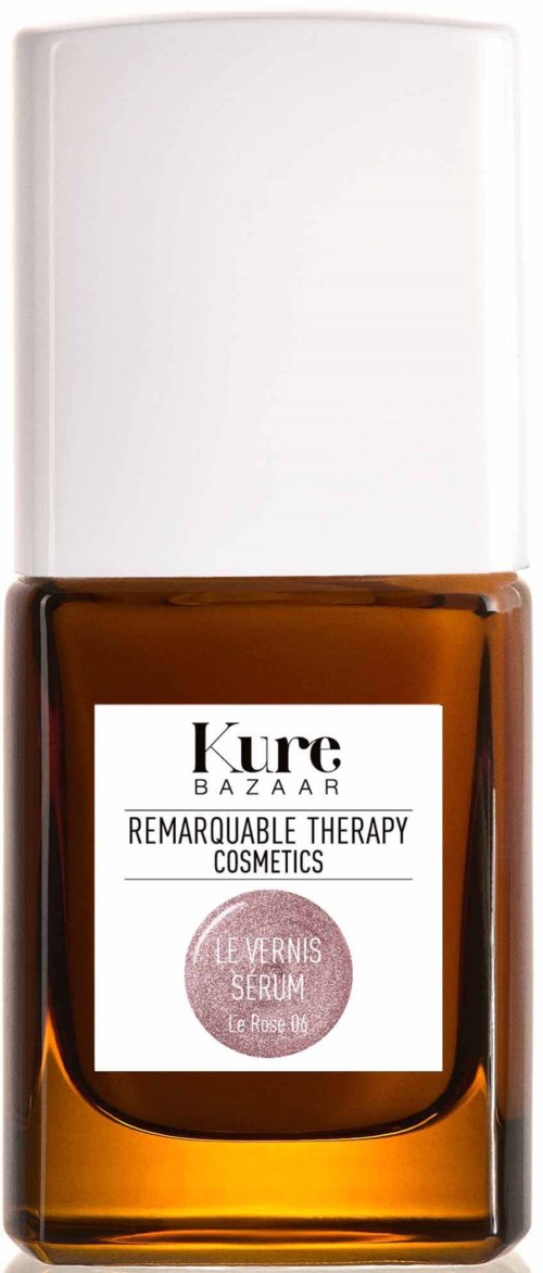 Kleine braune Glasflasche mit weißem Deckel, beschriftet 'Kure Bazaar' und 'Remarkable Therapy Cosmetics.'