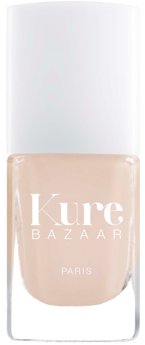 Ein Nagellackflasche mit weißem Deckel und Aufschrift 'Kure Bazaar Paris.'