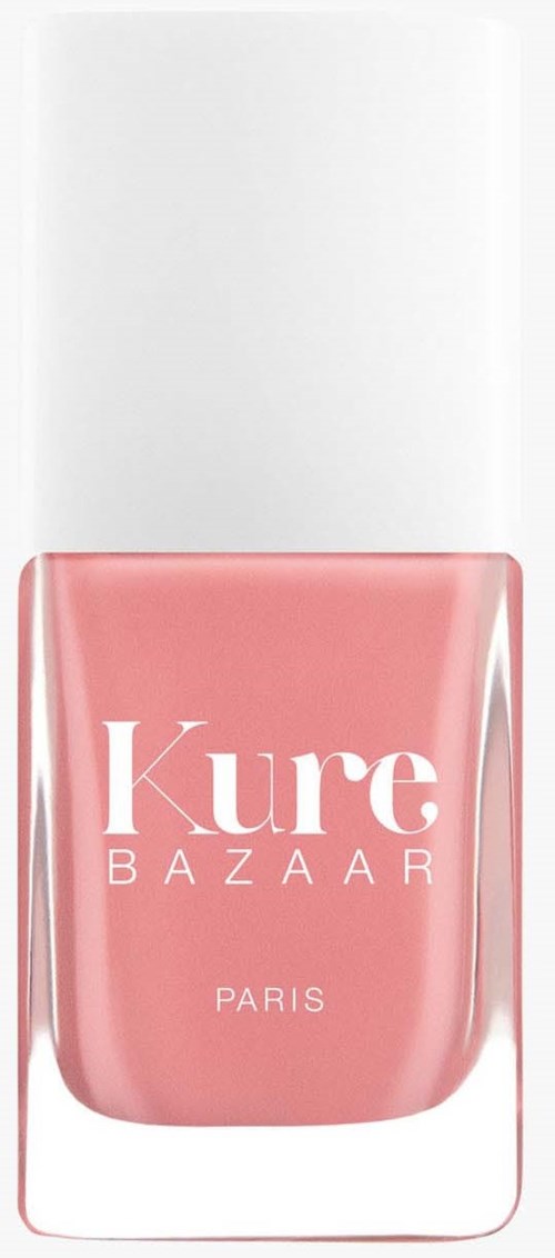 Eine rosa Nagellackflasche mit weißem Deckel, beschriftet "Kure BAZAAR PARIS."