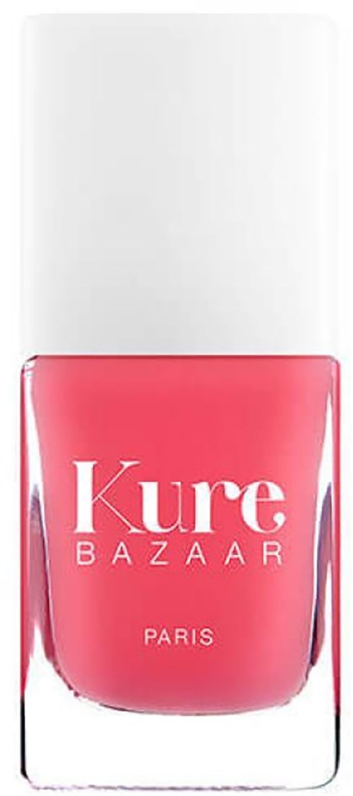 Eine rosa Nagellackflasche mit weißem Deckel, beschriftet 'Kure BAZAAR PARIS.'