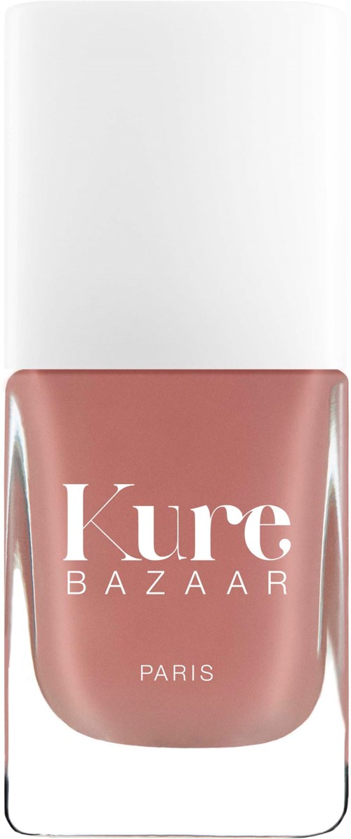 Ein Nagellackflasche mit weißem Deckel und pinker Farbe, beschriftet 'Kure BAZAAR PARIS'.