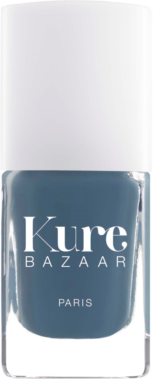Ein Nagellackflasche mit weißem Deckel, dunkelblau, beschriftet Kure Bazaar Paris.