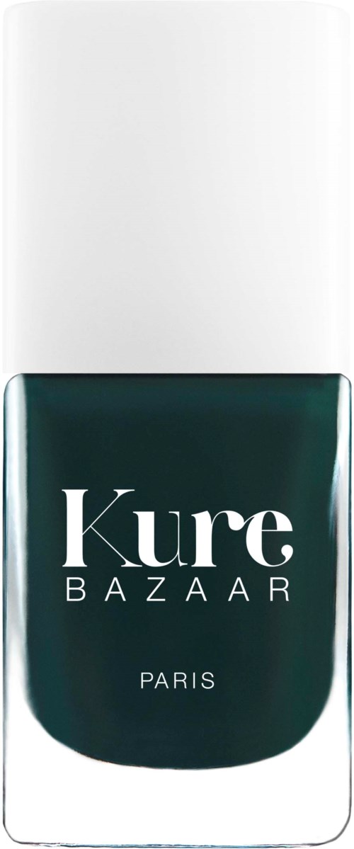 Ein Nagellackflasche mit weißem Deckel und dunkler grünlicher Farbe. Auf der Flasche steht 'Kure BAZAAR PARIS'.