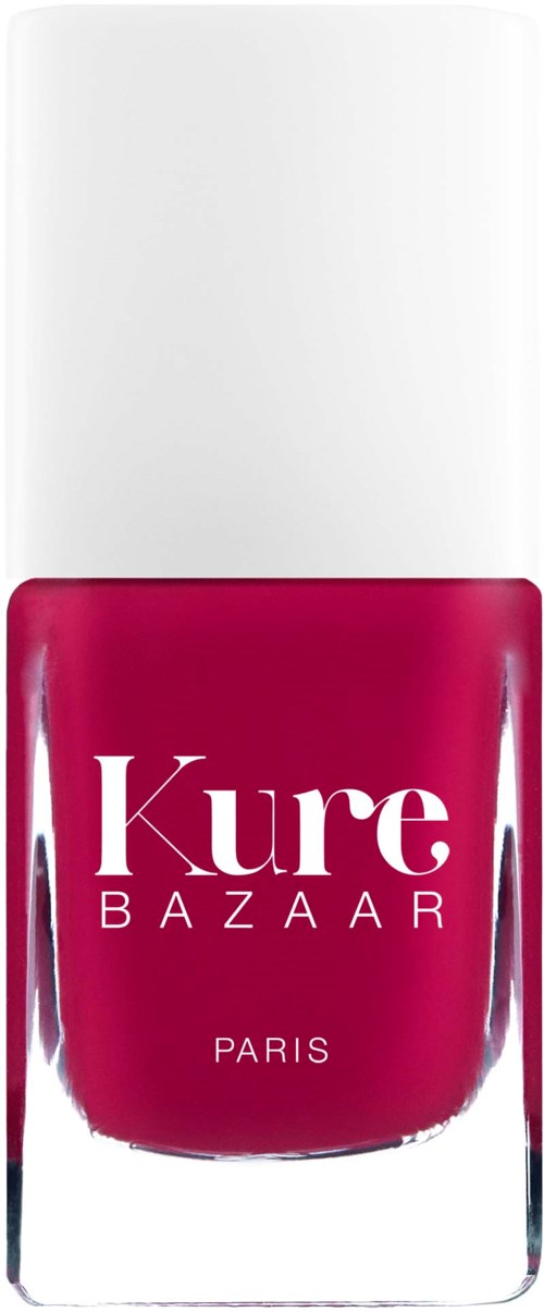 Eine Flasche Nagellack in knalligem Pink mit weißen Text, gekennzeichnet Kure Bazaar Paris.