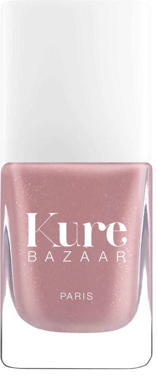Eine rosa Nagellackflasche mit weißem Deckel, beschriftet "Kure BAZAAR PARIS," vor einem weißen Hintergrund.