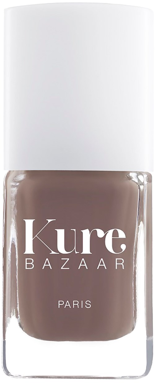 Eine Flasche brauner Nagellack mit weißem Deckel und Beschriftung 'Kure Bazaar Paris'.