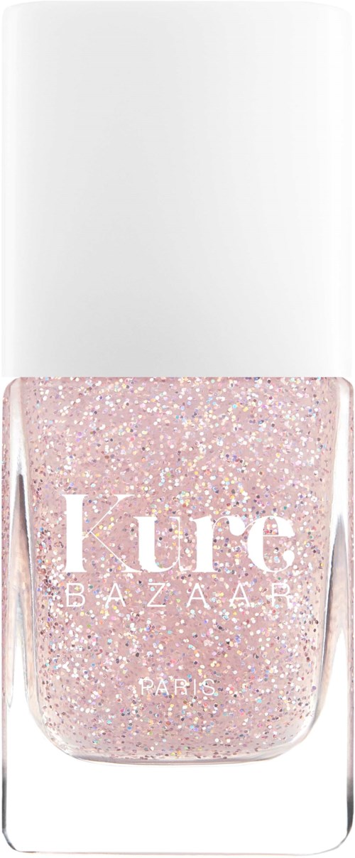 Eine Flasche rosa Glitter-Nagellack mit weißem Deckel, beschriftet "Lure BAZAAR PARIS".