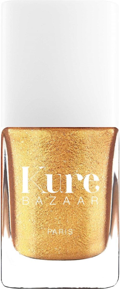 Ein goldfarbenes Nagellackfläschchen mit weißem Deckel, beschriftet mit 'Kure Bazaar Paris'.