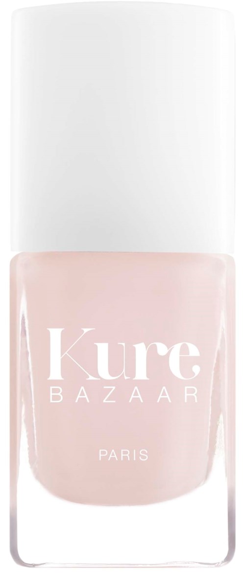 Eine Nagellackflasche mit rosa Farbe und weißem Deckel, mit der Aufschrift "Kure BAZAAR PARIS."