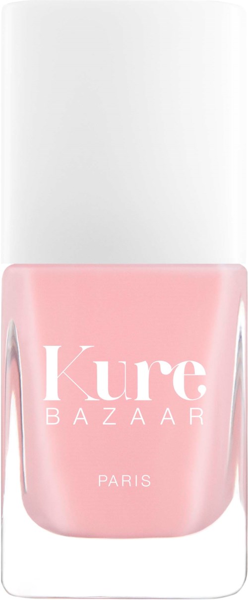 Eine rosa Nagellackflasche mit weißem Deckel, beschriftet mit 'Kure BAZAAR PARIS'.