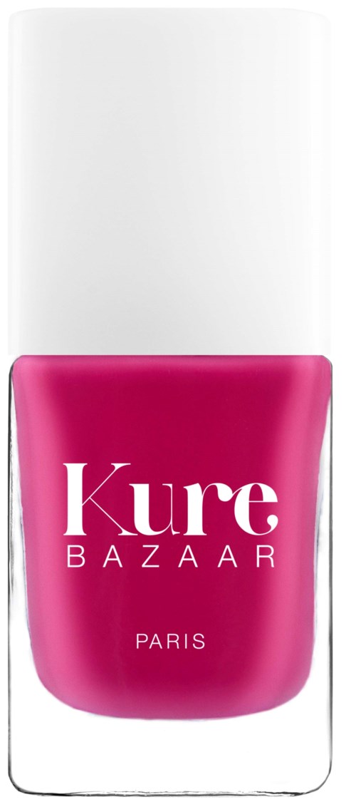 Eine Flasche rosa Nagellack mit weißem Deckel und der Aufschrift 'Kure Bazaar Paris'.