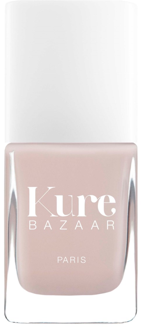Eine Flasche Kure Bazaar Nagellack in zartrosa mit weißem Deckel, minimalistisches Design, mit Schriftzug auf der Vorderseite.