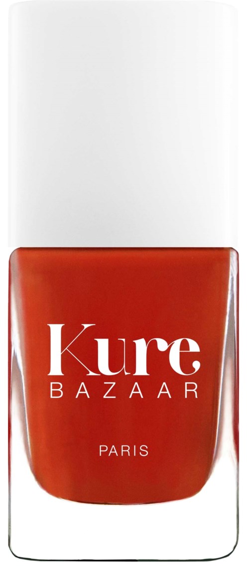 Ein Nagellackflasche mit weißem Deckel und roter Farbe. Das Etikett liest "Kure BAZAAR PARIS."