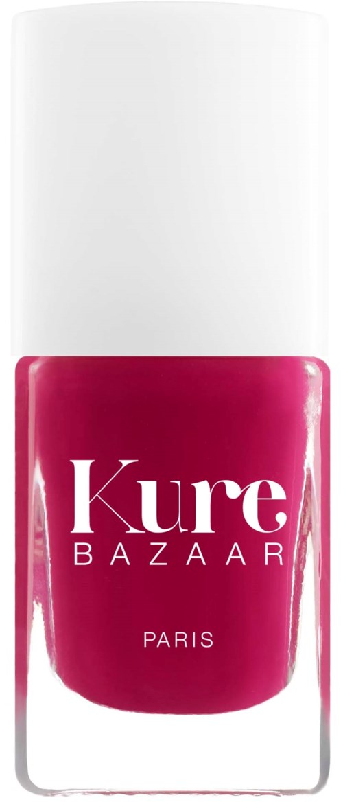 Eine Flasche rosa Nagellack mit weißem Deckel, beschriftet 'Kure BAZAAR PARIS.'