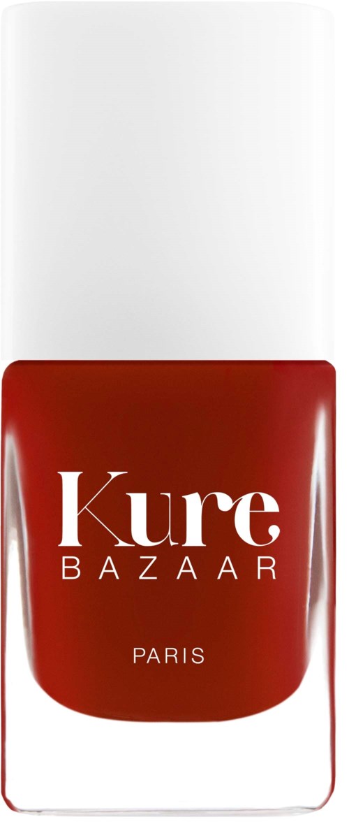 Eine rote Nagellackflasche mit weißem Deckel, Beschriftung Kure Bazaar Paris.