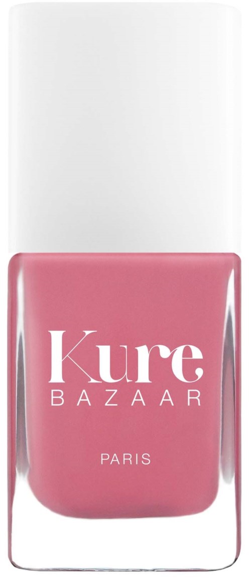 Rote Nagellackflasche mit weißem Deckel, etikettiert 'Kure BAZAAR PARIS'.