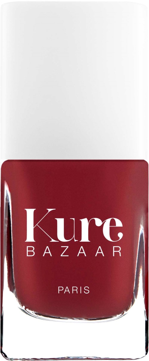 Eine Flasche roten Nagellacks mit weißem Deckel und 'Kure Bazar Paris' geschrieben.