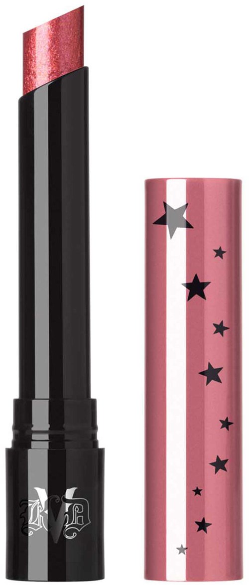En läppstift med en glittrig rosa hatt dekorerad med svarta stjärnor och en svart botten med silverdetaljer.