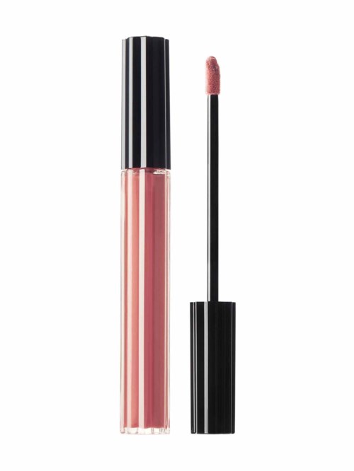 En läppglansflaska med applikatorvantar bredvid, innehållande rosa gloss.