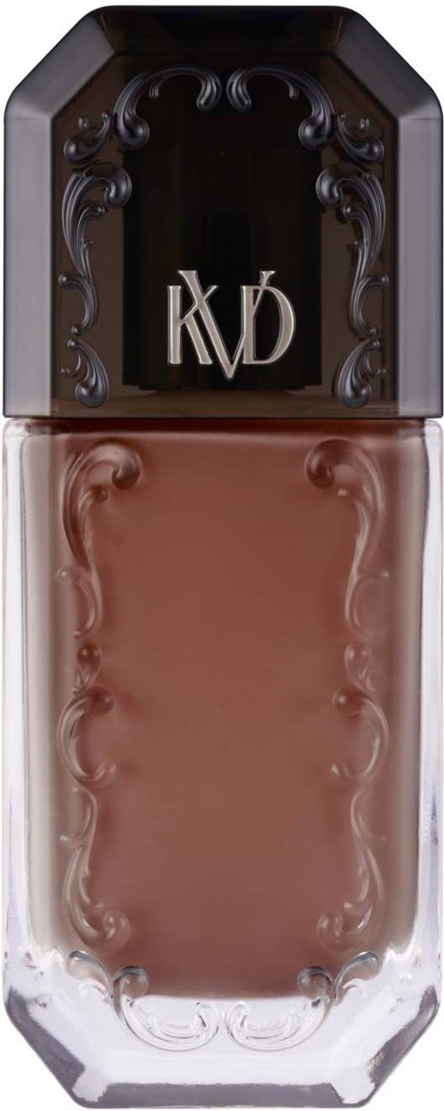Een bruine nagellakfles met een decoratieve zwarte dop en de letters 'KVD' aan de bovenkant.