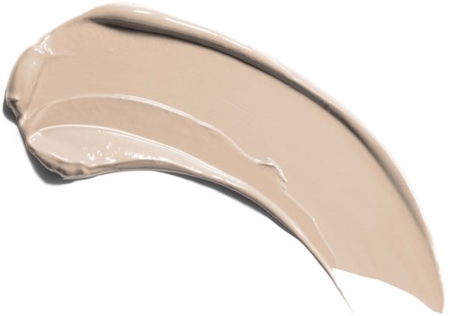 Grädde eller foundation applicerad med borste, visar en ljus beige färg.