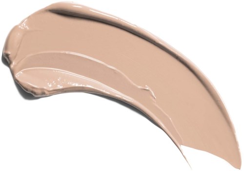 En strykning av beige flytande makeup på svart bakgrund.