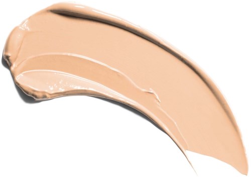 En beige makeupfoundationprov i en kurvig form med krämig textur.