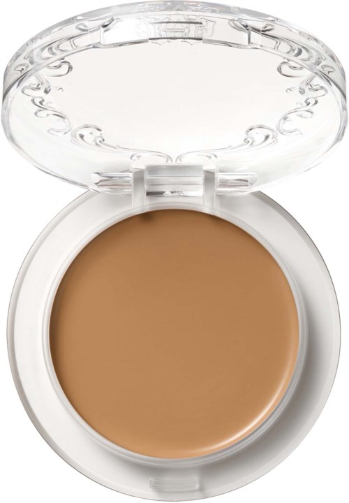 En liten make-up med ljusbrun foundation inuti, transparent lock och vit bas. Locket har dekorativa mönster.