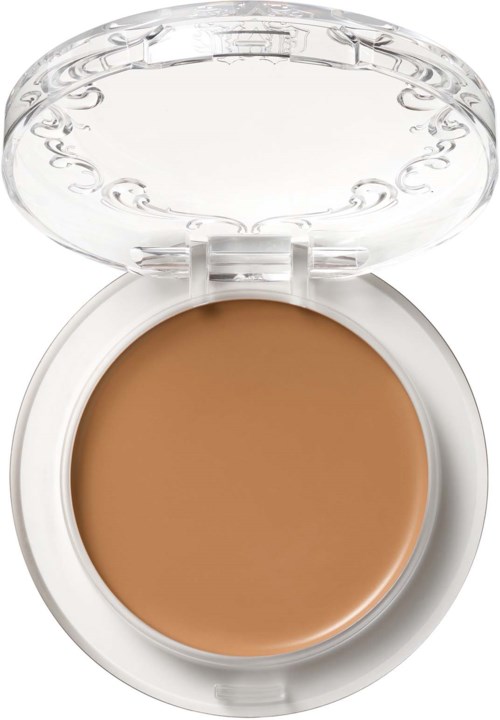 En liten rund behållare med tydligt lock, som innehåller beige ansiktspuder.