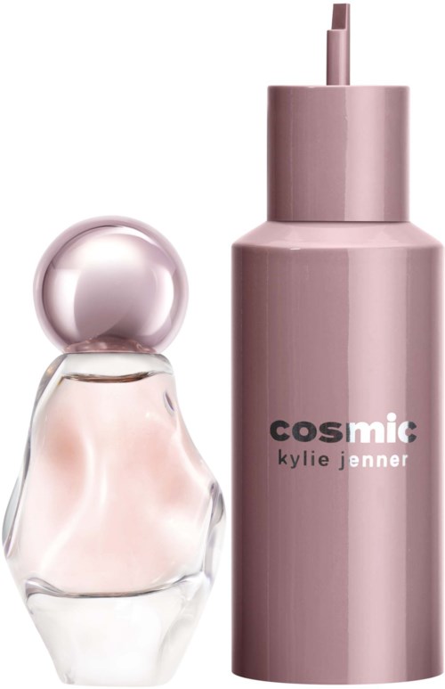 A bottle of Kylie Jenner's Cosmic perfume with a pink spray top and a rounded glass perfume container.